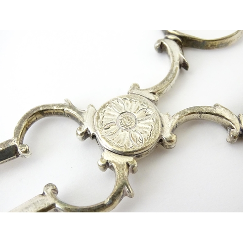 324 - 18thC Irish silver sugar nips. Together with silver plate sugar cutters with mother of pearl detail ... 