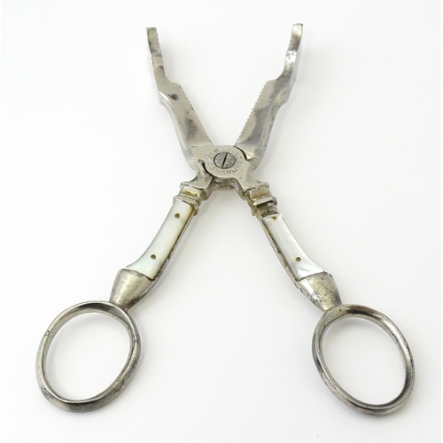 324 - 18thC Irish silver sugar nips. Together with silver plate sugar cutters with mother of pearl detail ... 