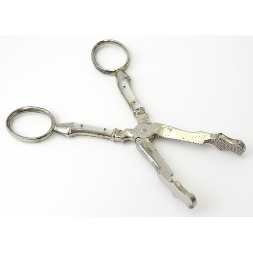 324 - 18thC Irish silver sugar nips. Together with silver plate sugar cutters with mother of pearl detail ... 