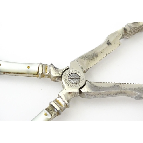 324 - 18thC Irish silver sugar nips. Together with silver plate sugar cutters with mother of pearl detail ... 