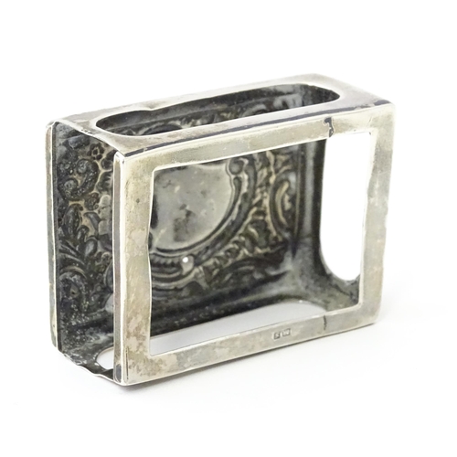 327 - A silver match box cover with embossed decoration, hallmarked Chester 1907. Approx 2 1/4