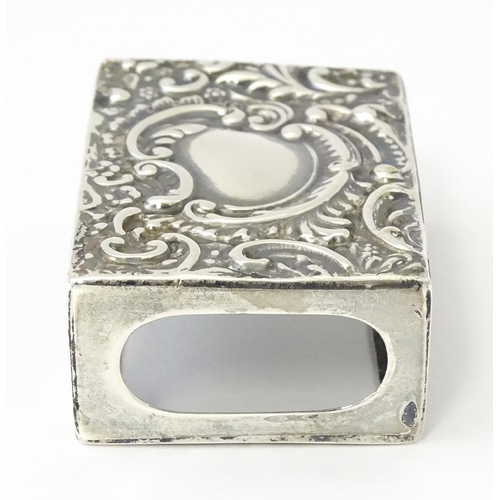 327 - A silver match box cover with embossed decoration, hallmarked Chester 1907. Approx 2 1/4