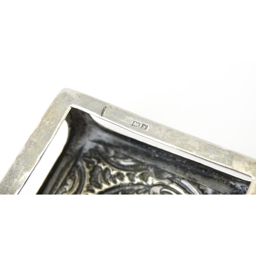 327 - A silver match box cover with embossed decoration, hallmarked Chester 1907. Approx 2 1/4