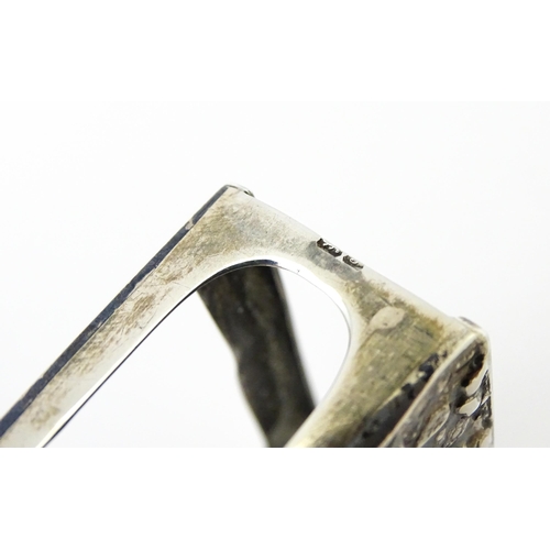 327 - A silver match box cover with embossed decoration, hallmarked Chester 1907. Approx 2 1/4