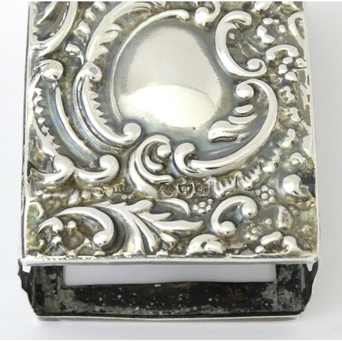 327 - A silver match box cover with embossed decoration, hallmarked Chester 1907. Approx 2 1/4