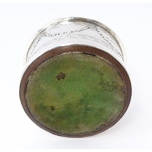 333 - A silver wine coaster with turned wooden base and swag detail, hallmarked Chester 1905, maker George... 