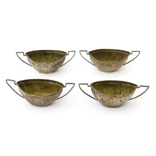 334 - A set of four Victorian silver twin handled salts with fluted detail hallmarked Birmingham 1899, mak... 