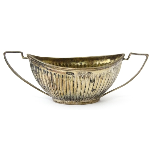 334 - A set of four Victorian silver twin handled salts with fluted detail hallmarked Birmingham 1899, mak... 