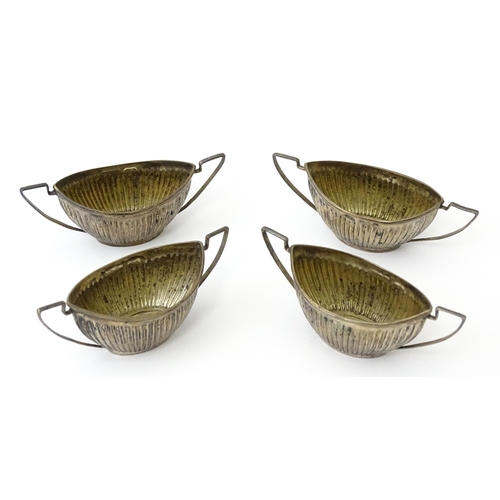 334 - A set of four Victorian silver twin handled salts with fluted detail hallmarked Birmingham 1899, mak... 