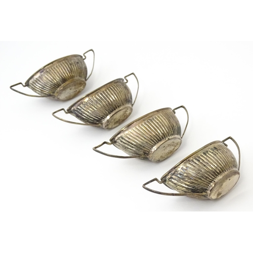 334 - A set of four Victorian silver twin handled salts with fluted detail hallmarked Birmingham 1899, mak... 