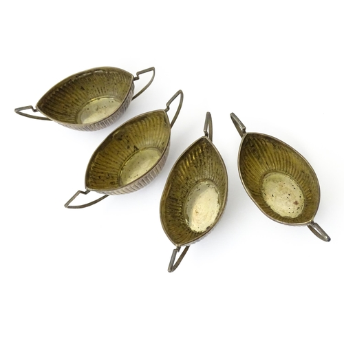 334 - A set of four Victorian silver twin handled salts with fluted detail hallmarked Birmingham 1899, mak... 