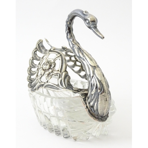 335 - A novelty glass table salt of swan form with silver detail. Approx. 4 1/2