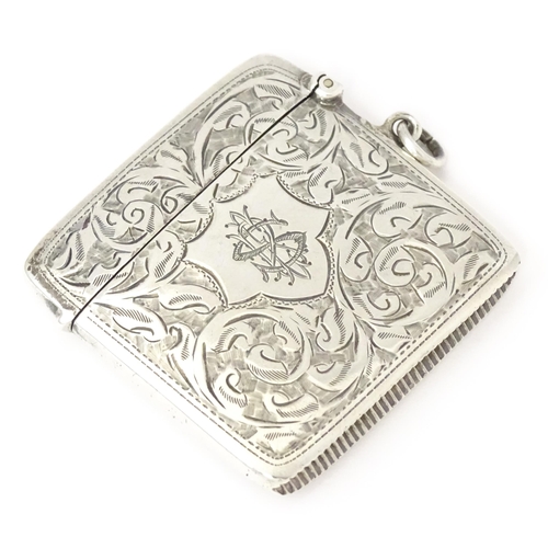 340 - A silver vesta case with engraved acanthus scroll decoration, hallmarked Chester 1910, maker Sydney ... 