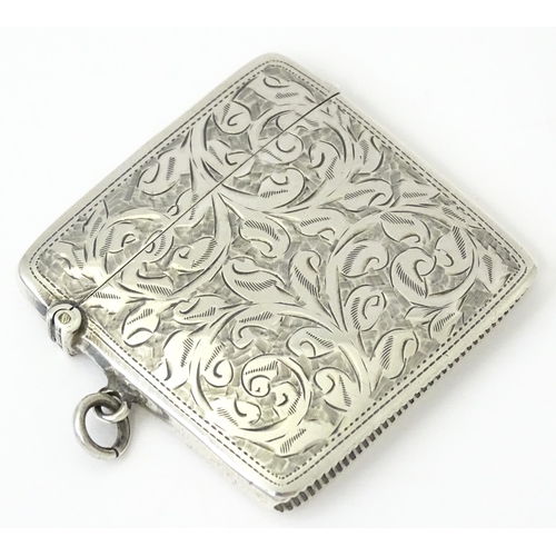 340 - A silver vesta case with engraved acanthus scroll decoration, hallmarked Chester 1910, maker Sydney ... 
