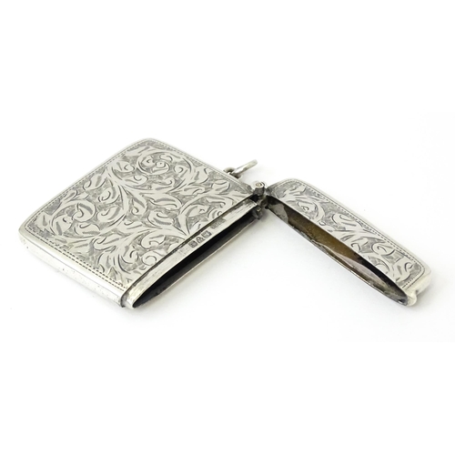 340 - A silver vesta case with engraved acanthus scroll decoration, hallmarked Chester 1910, maker Sydney ... 