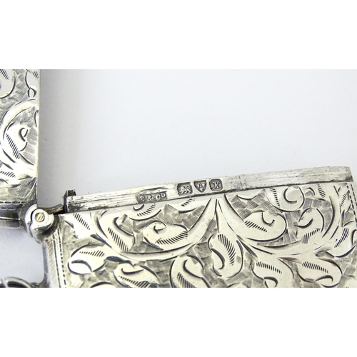 340 - A silver vesta case with engraved acanthus scroll decoration, hallmarked Chester 1910, maker Sydney ... 