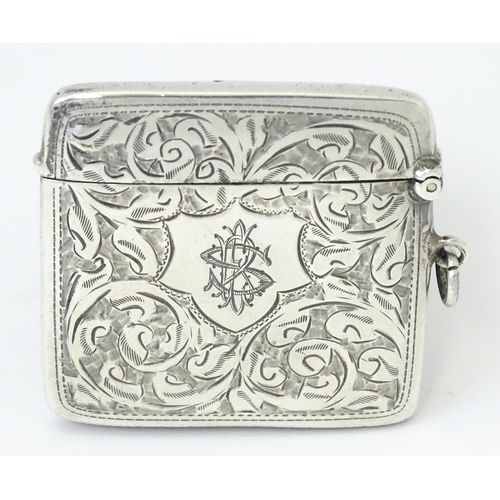 340 - A silver vesta case with engraved acanthus scroll decoration, hallmarked Chester 1910, maker Sydney ... 