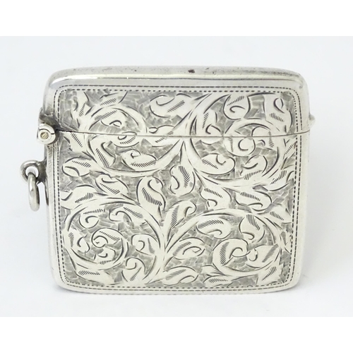 340 - A silver vesta case with engraved acanthus scroll decoration, hallmarked Chester 1910, maker Sydney ... 