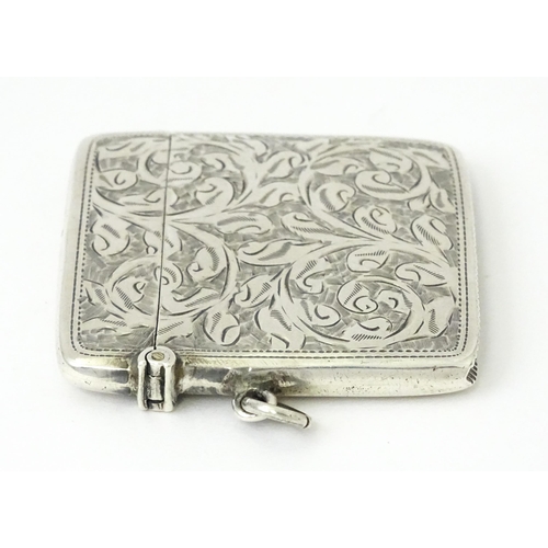 340 - A silver vesta case with engraved acanthus scroll decoration, hallmarked Chester 1910, maker Sydney ... 
