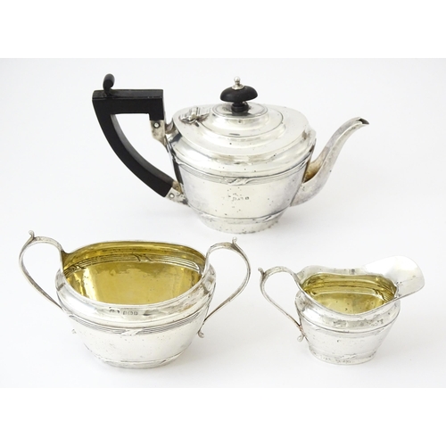 344 - A silver Bachelor's three piece tea set comprising teapot, sugar bowl and milk jug, hallmarked Birmi... 