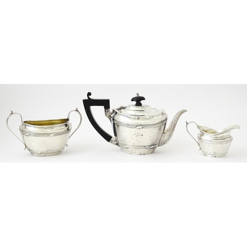 344 - A silver Bachelor's three piece tea set comprising teapot, sugar bowl and milk jug, hallmarked Birmi... 