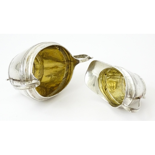 344 - A silver Bachelor's three piece tea set comprising teapot, sugar bowl and milk jug, hallmarked Birmi... 