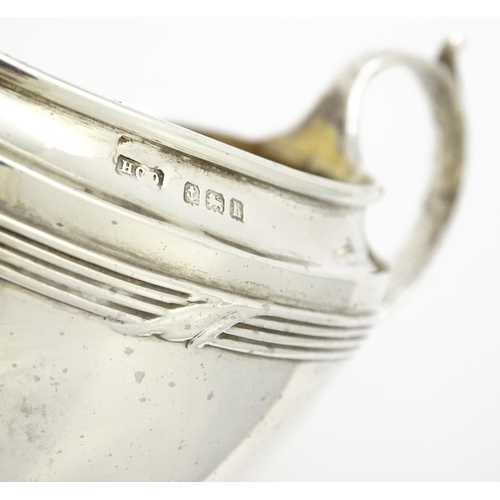 344 - A silver Bachelor's three piece tea set comprising teapot, sugar bowl and milk jug, hallmarked Birmi... 