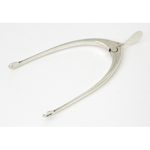 348 - Silver sugar tongs of wishbone form, hallmarked Birmingham 1931, maker James Swann & Son. Approx. 3