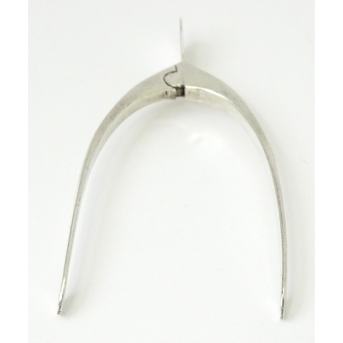 348 - Silver sugar tongs of wishbone form, hallmarked Birmingham 1931, maker James Swann & Son. Approx. 3