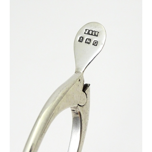 348 - Silver sugar tongs of wishbone form, hallmarked Birmingham 1931, maker James Swann & Son. Approx. 3