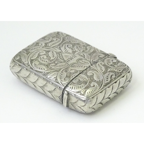 349 - A silver vesta case with engraved acanthus scroll decoration, hallmarked Birmingham 1897, maker JT. ... 