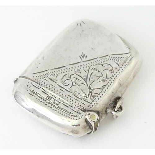 352 - A silver vesta case with engraved decoration, hallmarked Birmingham 1913, maker Thomas Hayes. Approx... 