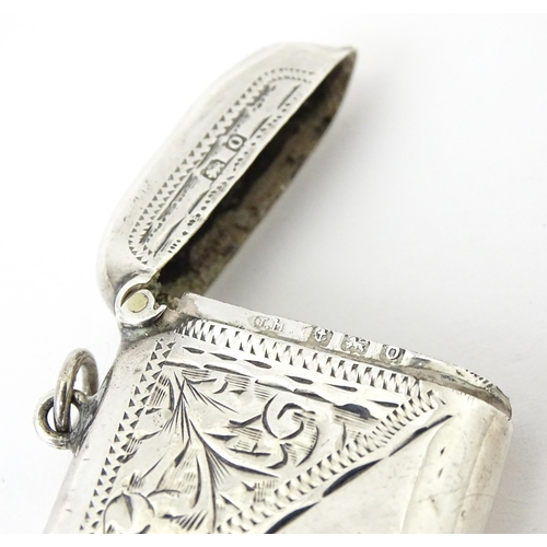 352 - A silver vesta case with engraved decoration, hallmarked Birmingham 1913, maker Thomas Hayes. Approx... 