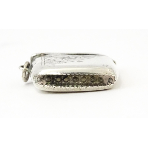 352 - A silver vesta case with engraved decoration, hallmarked Birmingham 1913, maker Thomas Hayes. Approx... 