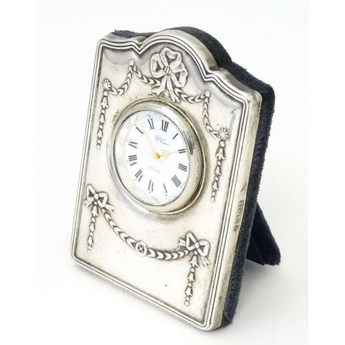 353 - An easel back clock with silver surround, hallmarked Sheffield 1995, maker Carrs of Sheffield. Appro... 