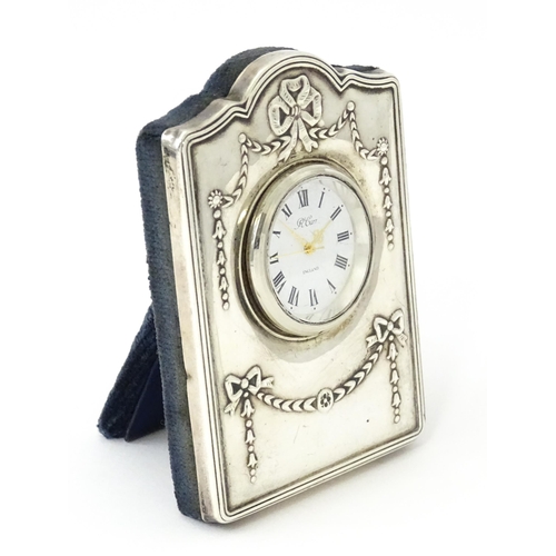 353 - An easel back clock with silver surround, hallmarked Sheffield 1995, maker Carrs of Sheffield. Appro... 