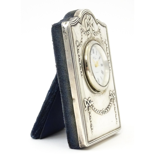 353 - An easel back clock with silver surround, hallmarked Sheffield 1995, maker Carrs of Sheffield. Appro... 