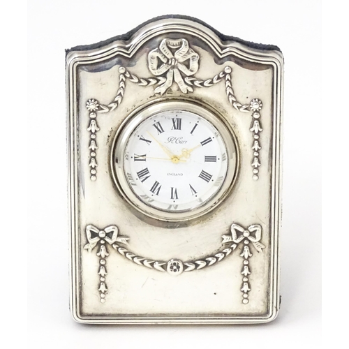 353 - An easel back clock with silver surround, hallmarked Sheffield 1995, maker Carrs of Sheffield. Appro... 