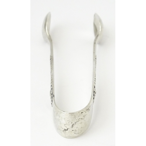 356 - Silver sugar tongs with engraved decoration, hallmarked Birmingham 1929, maker Joseph Gloster Ltd. A... 