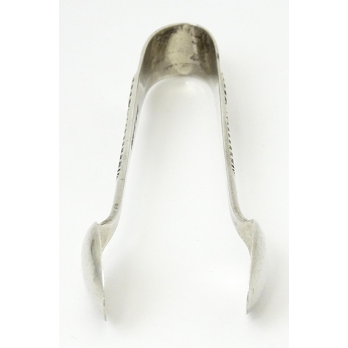 356 - Silver sugar tongs with engraved decoration, hallmarked Birmingham 1929, maker Joseph Gloster Ltd. A... 