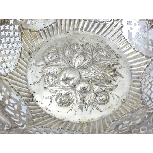 358 - A silver bon bon dish with embossed and pierced decoration, hallmarked Birmingham 1894, maker George... 