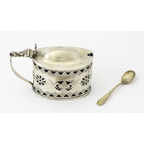 316 - A silver mustard pot with pierced decoration and blue glass liner, hallmarked Birmingham 1901. Toget... 
