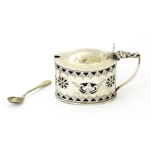 316 - A silver mustard pot with pierced decoration and blue glass liner, hallmarked Birmingham 1901. Toget... 