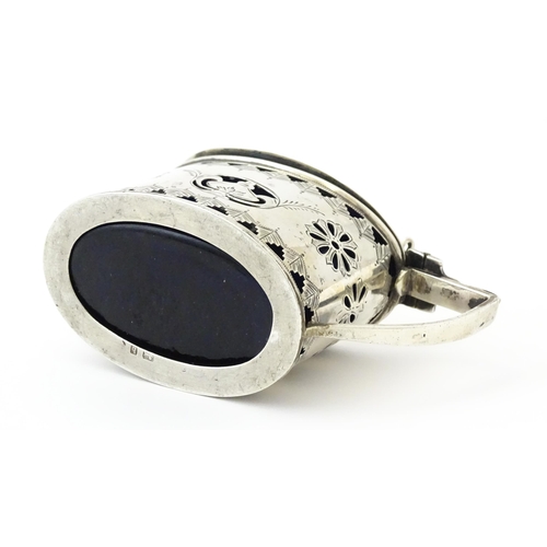 316 - A silver mustard pot with pierced decoration and blue glass liner, hallmarked Birmingham 1901. Toget... 