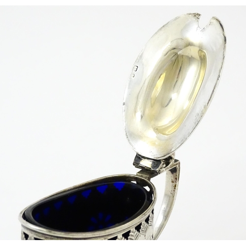 316 - A silver mustard pot with pierced decoration and blue glass liner, hallmarked Birmingham 1901. Toget... 