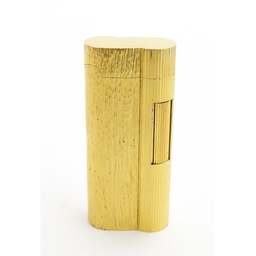 1191 - A Dunhill S-type pocket lighter with linear and hammered decoration. The base stamped with serial nu... 