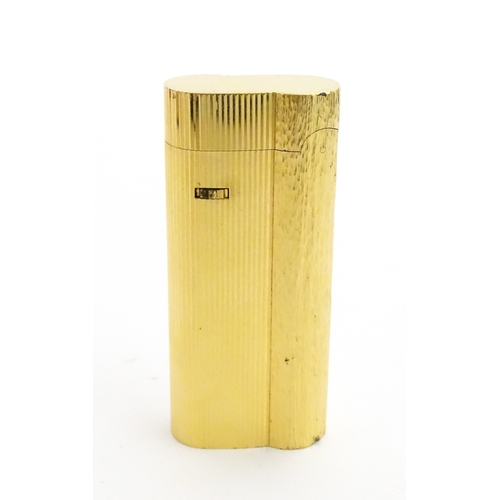 1191 - A Dunhill S-type pocket lighter with linear and hammered decoration. The base stamped with serial nu... 