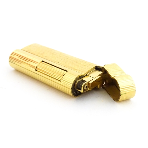 1191 - A Dunhill S-type pocket lighter with linear and hammered decoration. The base stamped with serial nu... 