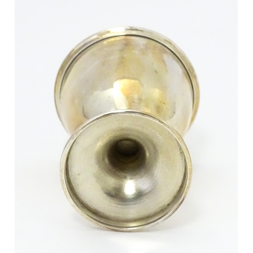 528 - A cased silver Christening set comprising egg cup, spoon and napkin ring, hallmarked Birmingham 1922... 