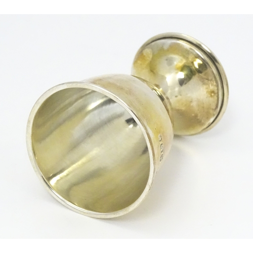 528 - A cased silver Christening set comprising egg cup, spoon and napkin ring, hallmarked Birmingham 1922... 